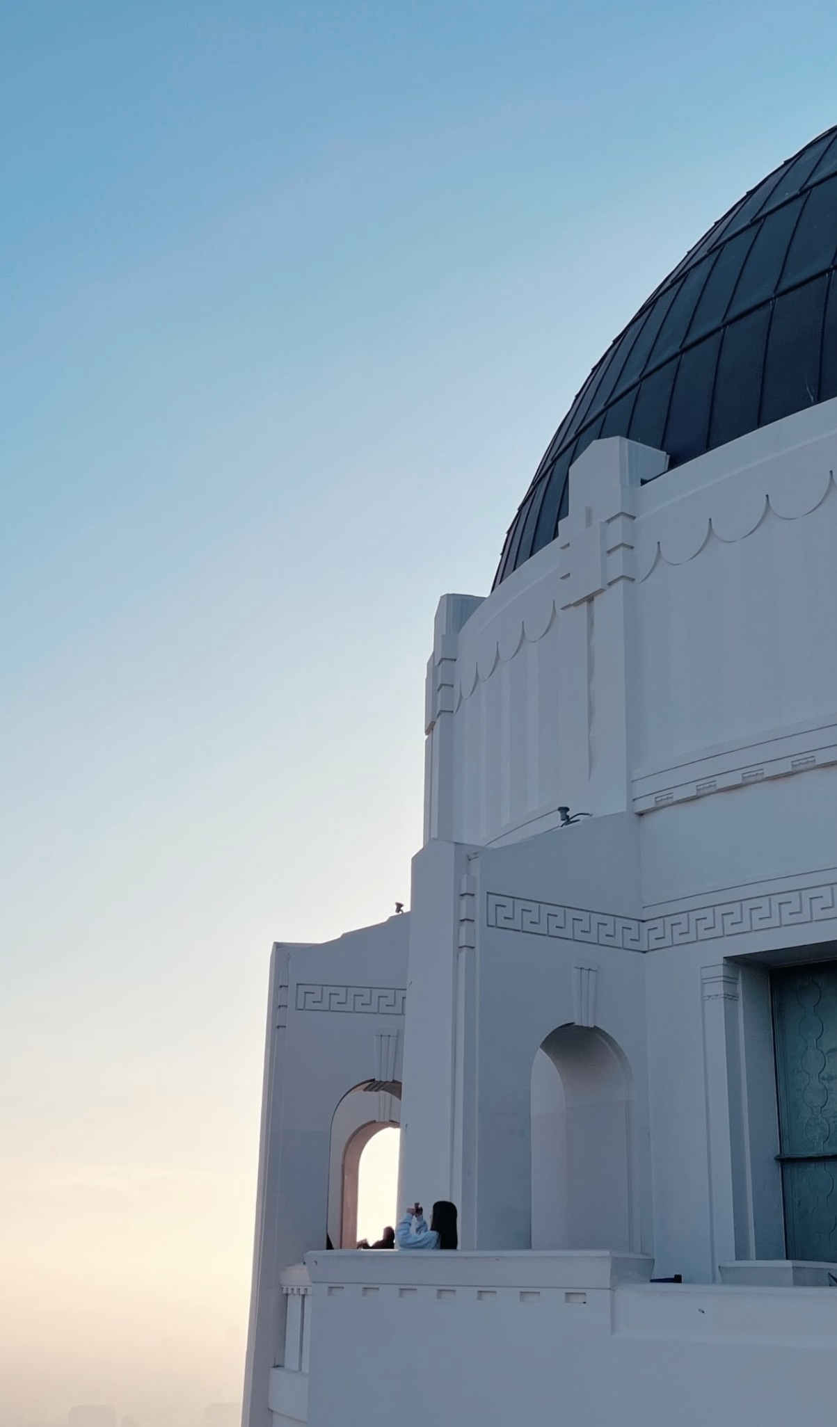 White Art Deco observatory against a pale sky